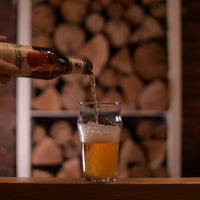 Side view of Nonix 19.75 oz. Stackable Pub Beer Glasses (Set of 12)