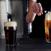 Side view of Nonix 19.75 oz. Stackable Pub Beer Glasses (Set of 12)