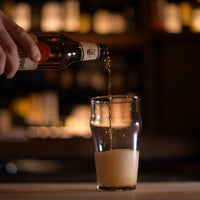 Side view of Nonix 19.75 oz. Stackable Pub Beer Glasses (Set of 12)