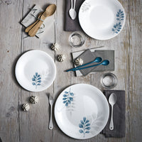 Side view of White Moon Botanica 10.75" Opal Glass Dinner Plate, Blue (Set of 24)