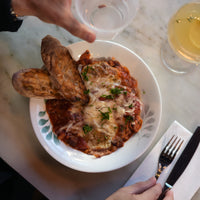 Side view of White Moon Botanica 9" Opal Glass Soup Plate, Green (Set of 24)