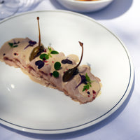 Side view of White Moon Chiaroscuro 10.75" Opal Glass Dinner Plate, Unico (Set of 24)